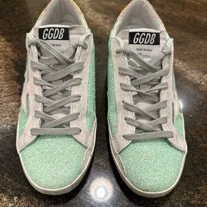 Golden Goose Mint Glitter Superstars.